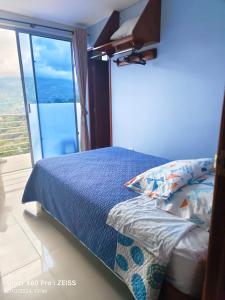 Postel nebo postele na pokoji v ubytování Hotel kristal campestre
