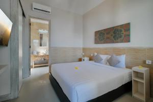 Postel nebo postele na pokoji v ubytování Villa Nakula Suites