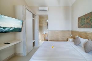 Postel nebo postele na pokoji v ubytování Villa Nakula Suites