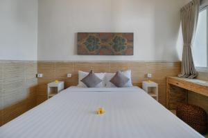Postel nebo postele na pokoji v ubytování Villa Nakula Suites