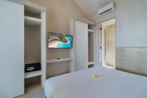 Postel nebo postele na pokoji v ubytování Villa Nakula Suites