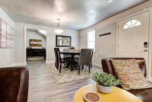 a living room and dining room with a table and chairs at Indie Escape II-Stones throw to Plaza in Oklahoma City