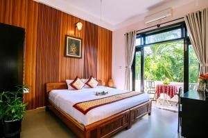 Cama ou camas em um quarto em Ngan Phu Villa