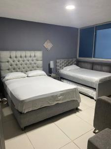 Postel nebo postele na pokoji v ubytování Hermosa vista mar y ciudad