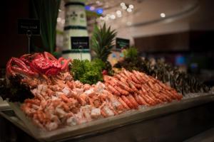 a display of meat and vegetables on a counter at The Berkeley Hotel Pratunam in Bangkok