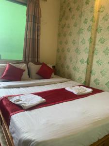 Katil atau katil-katil dalam bilik di The Tranqulity Inn