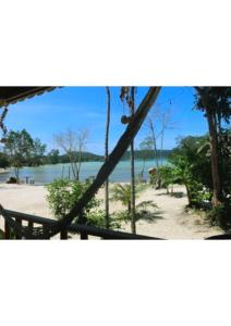 a view of a beach from a window at Mangrove Beach Bungalows in Koh Rong Sanloem