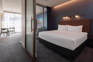Postel nebo postele na pokoji v ubytování Rydges Ringwood