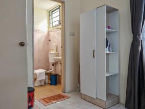 a bathroom with a white cabinet in a room at Riverside Landed House 河景湾 in Kota Kinabalu +47 photos