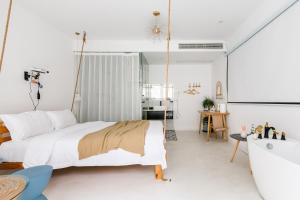 Ένα ή περισσότερα κρεβάτια σε δωμάτιο στο Shanghai ruochu designer Guesthouse上海若初设计师民宿--近上海浦东国际机场及迪士尼