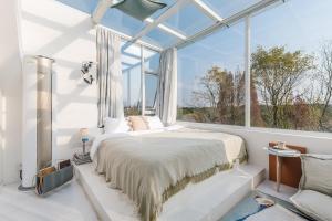 Postel nebo postele na pokoji v ubytování Shanghai ruochu designer Guesthouse上海若初设计师民宿--近上海浦东国际机场及迪士尼 + 37 fotografií