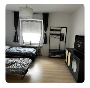 Postel nebo postele na pokoji v ubytování Gemütliche Wohnung in Belecke