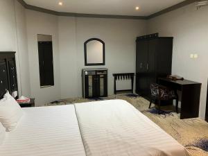 Postel nebo postele na pokoji v ubytování فندق غمامة للشقق المخدومة GHAMAMA Hotel Serviced Apartments