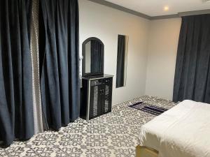 Postel nebo postele na pokoji v ubytování فندق غمامة للشقق المخدومة GHAMAMA Hotel Serviced Apartments