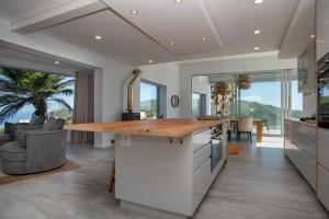 a kitchen with a large island with a wooden counter top at Eagles Nest in Knysna