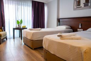 Postel nebo postele na pokoji v ubytování Marmaris Alkan Hotel