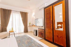 Ein Bett oder Betten in einem Zimmer der Unterkunft Uppuveli Beach by DSK