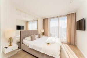 Posteľ alebo postele v izbe v ubytovaní GA Luxury Apartments M45