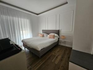 Postel nebo postele na pokoji v ubytování Be Your Home - Riviera Suites