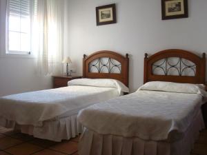Postel nebo postele na pokoji v ubytování Hotel Restaurante El Duque