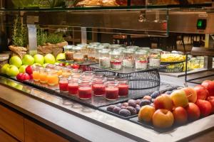 a buffet line with many different types of drinks at Hotel Svoboda - Terme Krka in Strunjan