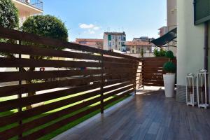 a wooden fence in front of a house at B&B Rosa e Rino in Turin
