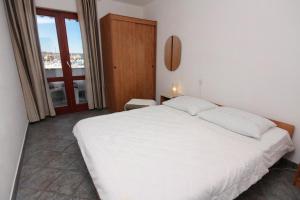 Postel nebo postele na pokoji v ubytování Apartments Vala