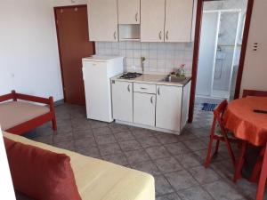 Kuchyň nebo kuchyňský kout v ubytování Apartments Vala