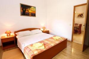 Posteľ alebo postele v izbe v ubytovaní Apartments Stuk