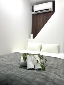 Ένα ή περισσότερα κρεβάτια σε δωμάτιο στο Ikebukuro Area R1 NishiikeApartment 5F No Elevator