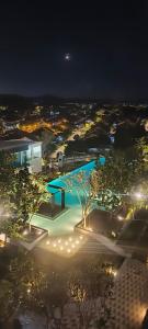 a view of a building at night with lights at HABITUS Elmina Denai Alam in Shah Alam