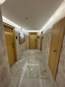 a hallway with two doors and a tile floor at Gulec Hotel & Spa - Special Category in Istanbul +48 photos
