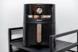 a blender sitting on top of a shelf at Charming Apartment in Liverpool City Centre - Peaceful Sleep! in Liverpool +20 photos