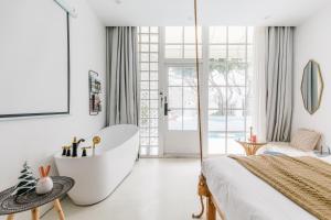 Ένα ή περισσότερα κρεβάτια σε δωμάτιο στο Shanghai ruochu designer Guesthouse上海若初设计师民宿--近上海浦东国际机场及迪士尼