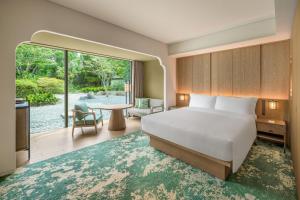 a hotel room with a bed and a patio at Shisui, a Luxury Collection Hotel, Nara in Nara +37 photos