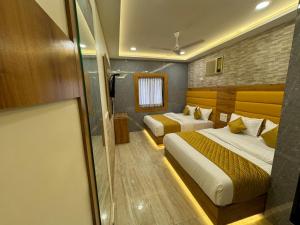 Postel nebo postele na pokoji v ubytování Hotel National - Grant Road