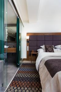 Posteľ alebo postele v izbe v ubytovaní Hotel Bristol Tradition and Luxury