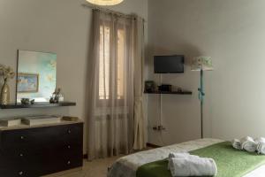 Ospitaci - Via SantAndrea客房内的一张或多张床位