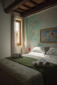 Ospitaci - Via SantAndrea客房内的一张或多张床位