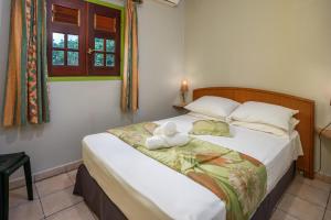 Postel nebo postele na pokoji v ubytování Villa Vanille - Maison avec piscine partagée + 7 fotografií