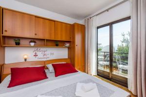 Postel nebo postele na pokoji v ubytování Apartments Goge