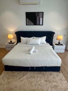 Postel nebo postele na pokoji v ubytování Luxury Suite at Quill Residences