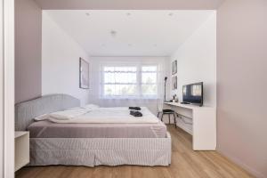 Postel nebo postele na pokoji v ubytování GoldenHugo rooms