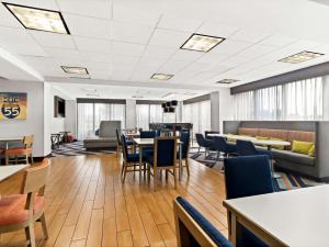 a waiting room with tables and chairs and tablesktop at Hampton Inn Blytheville in Blytheville