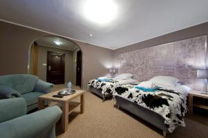 เตียงในห้องที่ Hotel New Wave