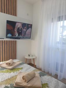 Posteľ alebo postele v izbe v ubytovaní Apartman Emilija