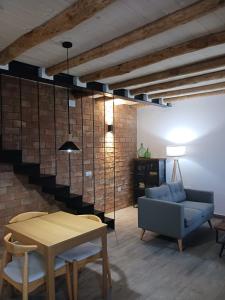 a living room with a couch and a table at La Casa de mi Tía María in Cortelazor