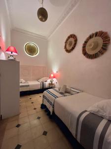 Voodi või voodid majutusasutuse Le riad de l'étoile ocre - COTG toas