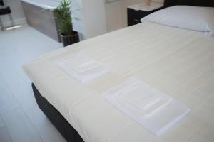 Postel nebo postele na pokoji v ubytování B&B La PerlaNera