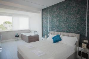 Postel nebo postele na pokoji v ubytování B&B La PerlaNera